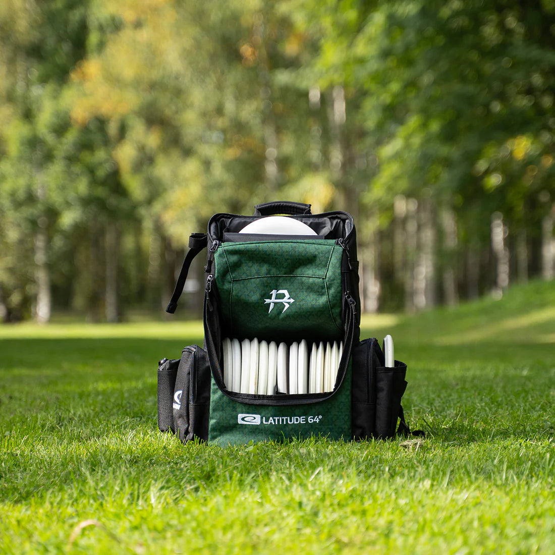 Latitude 64 Core Pro E3 Isaac Robinson signature backpack outdoors on the course
